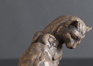 Cleaning Cat bronze statue