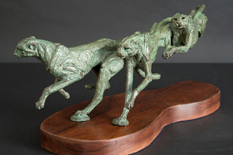 Cheetah stretching bronze statue