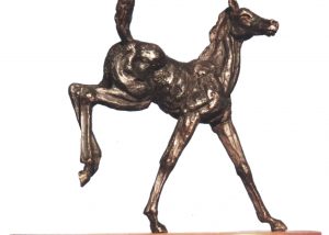 miniature bronze kicking foal